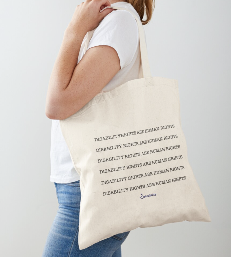 Canvas tote bag that has repeated text that reads "Disability rights are human rights" with the Dateability logo below.